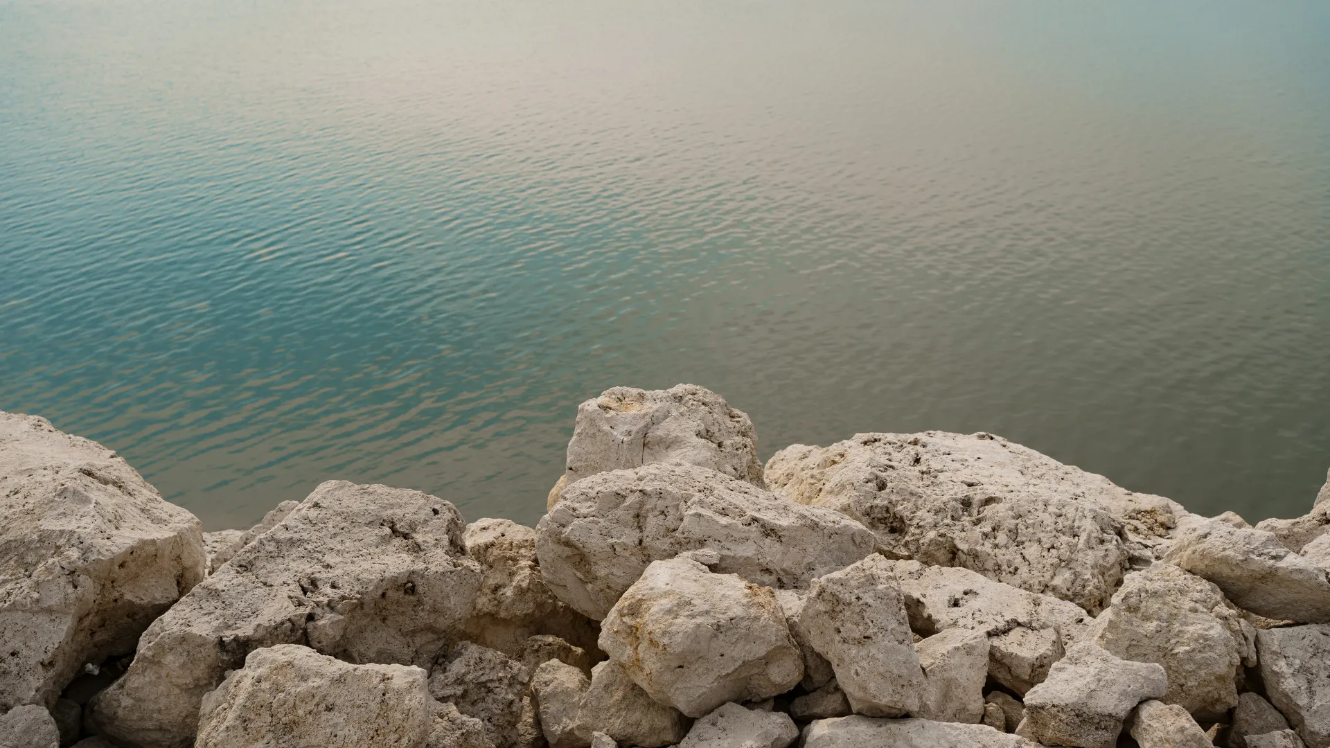 Weathered stone at the water's edge