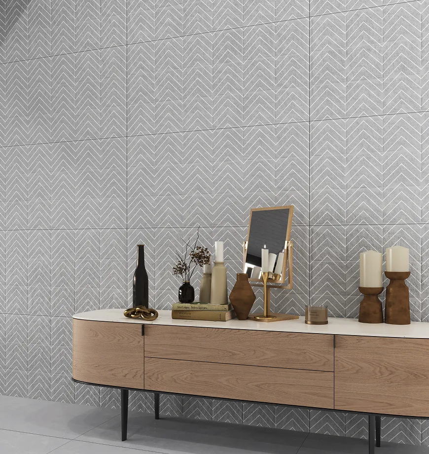Chevron textured tiles behind a wooden sideboard