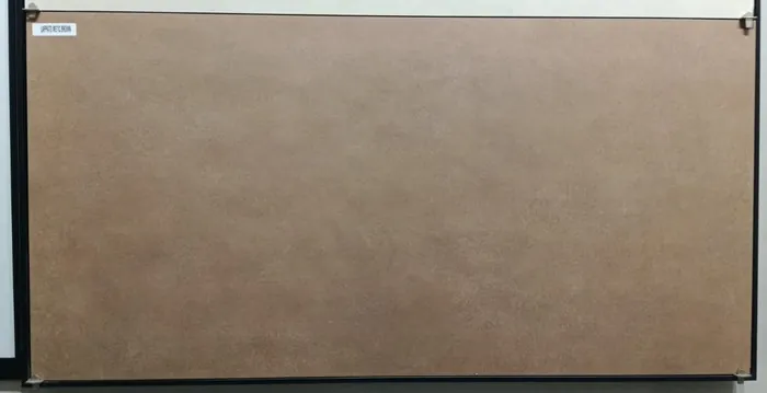 METIC BROWN In a room